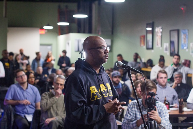 Audience member asks a question