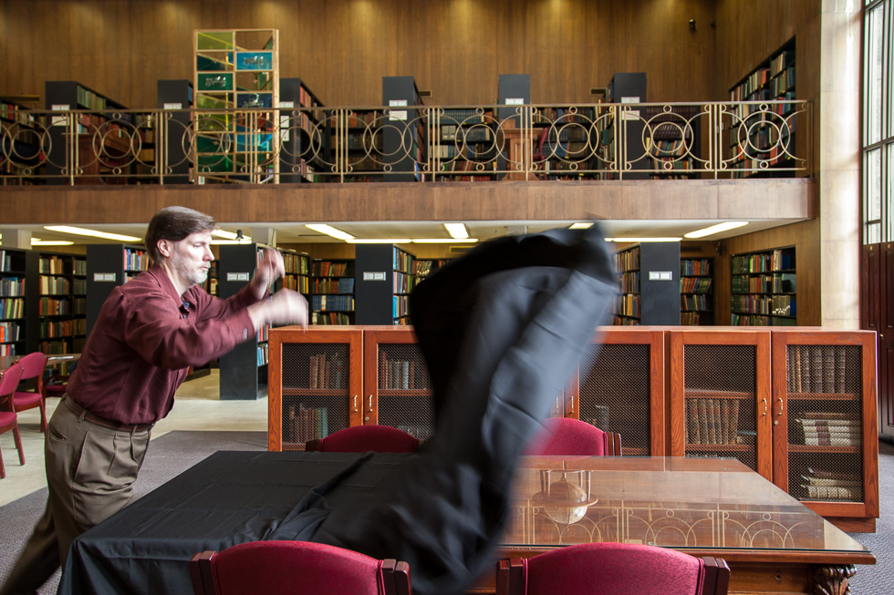 Mark Bowden, coordinator for special collections for the Detroit Public Library, setting up to display a few pieces from the Burton Historical Collection