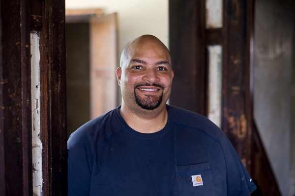 Harris in the doorframe of his in progress building